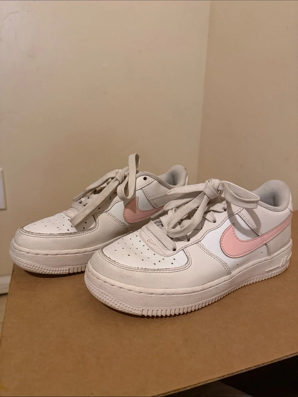 Nike White Low-Top Sneakers with Pink Swoosh